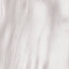 Licht beige marmeren textuur met zachte golven.